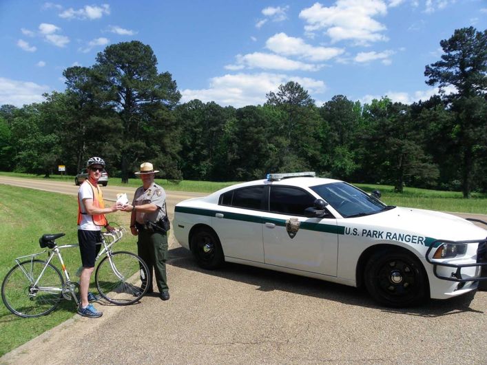 Bike travel in National Parks: A bike light and high visibility vest giveaway makes cyclists more visible on the Natchez Trace. 